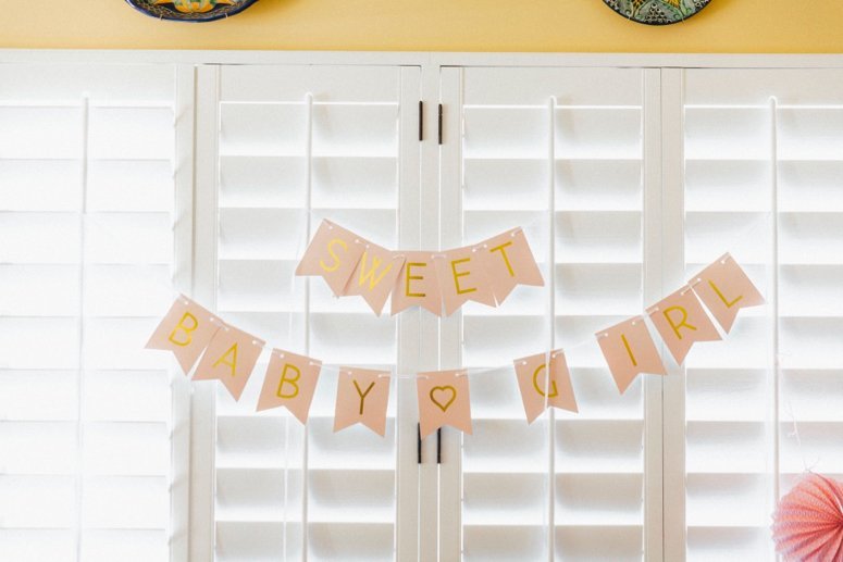 baby girl baby shower banner. Click to see the rest of the details from this tea party baby shower in the post! 